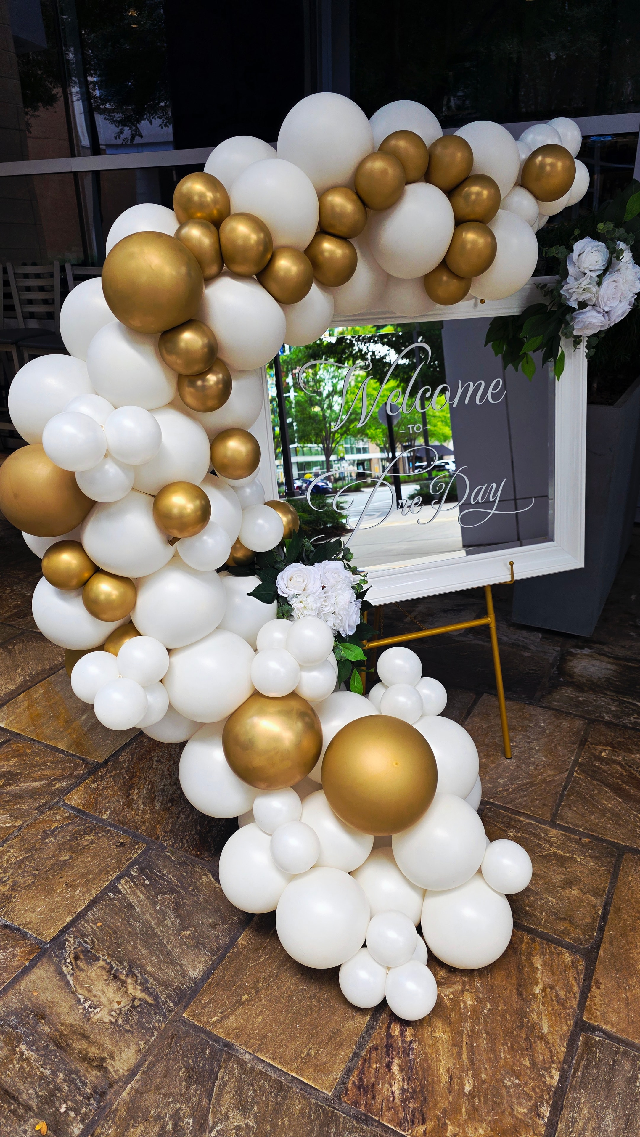 Welcome to Dre Day gold and white balloon installation